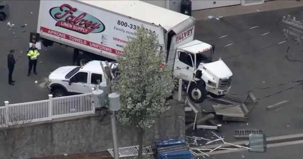 Truck Hangs Over Wall In Norfolk After Crashing Into Gas Pumps